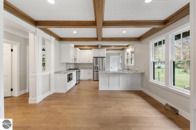 This brilliantly restored home delivers comfort, charm, and on Charlevoix Golf Club in Michigan - for sale on GolfHomes.com, golf home, golf lot