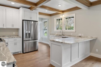 This brilliantly restored home delivers comfort, charm, and on Charlevoix Golf Club in Michigan - for sale on GolfHomes.com, golf home, golf lot