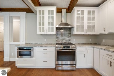 This brilliantly restored home delivers comfort, charm, and on Charlevoix Golf Club in Michigan - for sale on GolfHomes.com, golf home, golf lot