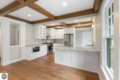 This brilliantly restored home delivers comfort, charm, and on Charlevoix Golf Club in Michigan - for sale on GolfHomes.com, golf home, golf lot