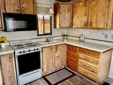 This darling Park Model Home is very clean, has a washer/dryer on Green Spring Country Club in Utah - for sale on GolfHomes.com, golf home, golf lot