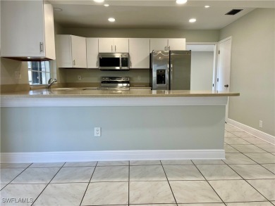 CLEAN, CRISP and FRESHLY PAINTED CORNER UNIT! This condo is on Myerlee Country Club in Florida - for sale on GolfHomes.com, golf home, golf lot