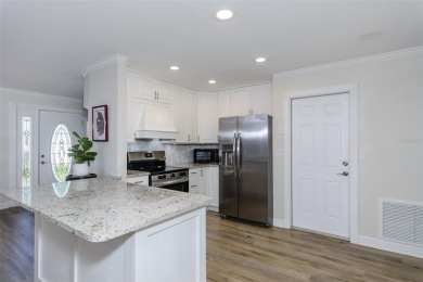 Looking for a move-in ready, completely updated 2Br/2Ba/2Gar on Lansbrook Golf Club in Florida - for sale on GolfHomes.com, golf home, golf lot