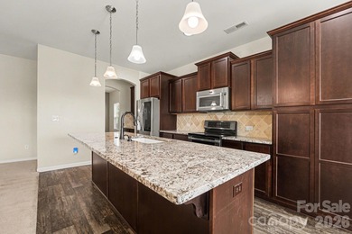 3% Assumable FHA Rate! Welcome to life ON the golf course in the on Fox Den Country Club in North Carolina - for sale on GolfHomes.com, golf home, golf lot