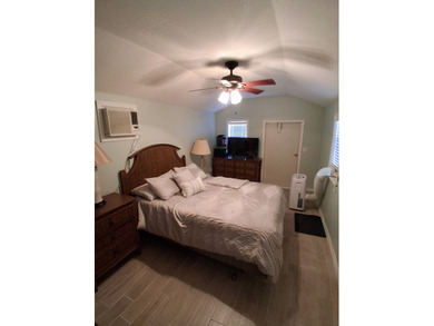 LARGE RV LOT WITH OVERSIZED PORT, BEDROOM, BATH, PATIO AREA AND on Deer Creek RV Golf Resort in Florida - for sale on GolfHomes.com, golf home, golf lot