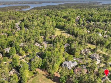 Discover unparalleled luxury living in this meticulously crafted on The Preserve At Jordan Lake Golf Club in North Carolina - for sale on GolfHomes.com, golf home, golf lot