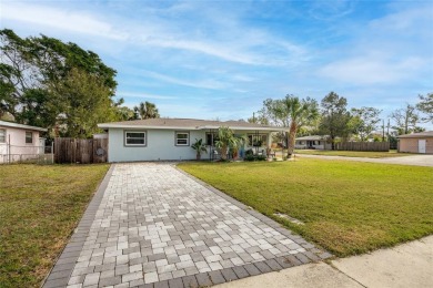 You don't want to miss this stunning, updated corner lot home in on Mangrove Bay Golf Course in Florida - for sale on GolfHomes.com, golf home, golf lot