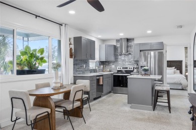 You don't want to miss this stunning, updated corner lot home in on Mangrove Bay Golf Course in Florida - for sale on GolfHomes.com, golf home, golf lot