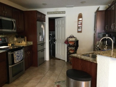 Nicely maintained concrete block home in the much sought after on Spanish Lakes I in Florida - for sale on GolfHomes.com, golf home, golf lot