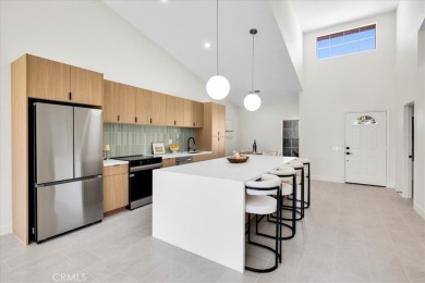 As you walk into this fully remodeled 2-bedroom, 2.5-bath home on  in California - for sale on GolfHomes.com, golf home, golf lot