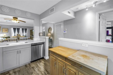 Experience refined Florida living in this exceptional, move-in on Feather Sound Country Club in Florida - for sale on GolfHomes.com, golf home, golf lot