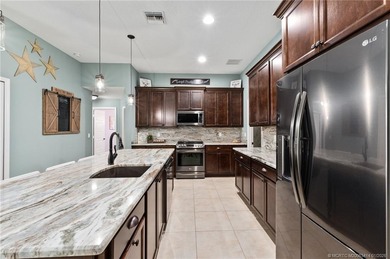 Every day is a vacation in this custom CBS 4 bedroom, 4.5 bath on The Cape Club of Palm City in Florida - for sale on GolfHomes.com, golf home, golf lot