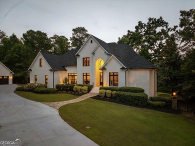 Welcome to luxury living on the largest lot in Riverwood on Champions Retreat Golf Club in Georgia - for sale on GolfHomes.com, golf home, golf lot