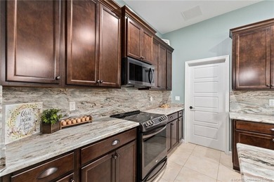 Every day is a vacation in this custom CBS 4 bedroom, 4.5 bath on The Cape Club of Palm City in Florida - for sale on GolfHomes.com, golf home, golf lot