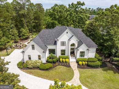 Welcome to luxury living on the largest lot in Riverwood on Champions Retreat Golf Club in Georgia - for sale on GolfHomes.com, golf home, golf lot