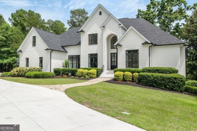Welcome to luxury living on the largest lot in Riverwood on Champions Retreat Golf Club in Georgia - for sale on GolfHomes.com, golf home, golf lot