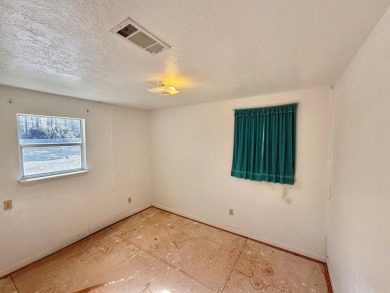 Discover the potential of this cozy 2-bed, 2-bath home in the on Pendleton Harbor in Texas - for sale on GolfHomes.com, golf home, golf lot