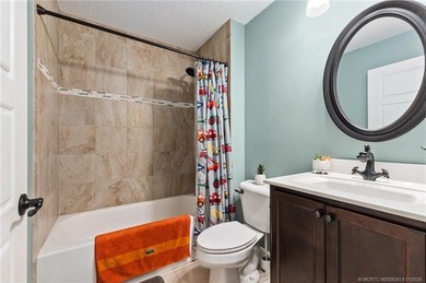 Every day is a vacation in this custom CBS 4 bedroom, 4.5 bath on The Cape Club of Palm City in Florida - for sale on GolfHomes.com, golf home, golf lot