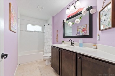 Every day is a vacation in this custom CBS 4 bedroom, 4.5 bath on The Cape Club of Palm City in Florida - for sale on GolfHomes.com, golf home, golf lot