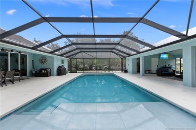 Every day is a vacation in this custom CBS 4 bedroom, 4.5 bath on The Cape Club of Palm City in Florida - for sale on GolfHomes.com, golf home, golf lot