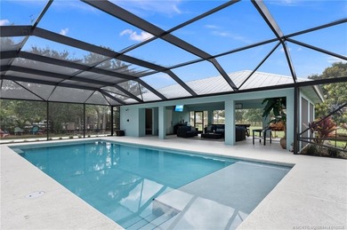 Every day is a vacation in this custom CBS 4 bedroom, 4.5 bath on The Cape Club of Palm City in Florida - for sale on GolfHomes.com, golf home, golf lot