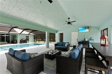 Every day is a vacation in this custom CBS 4 bedroom, 4.5 bath on The Cape Club of Palm City in Florida - for sale on GolfHomes.com, golf home, golf lot