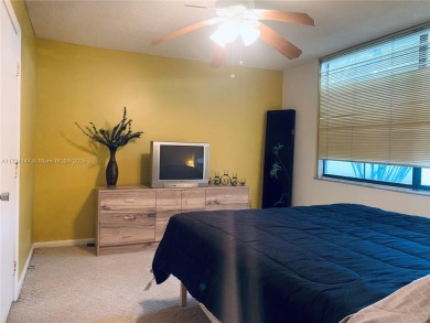 Charming and roomy 2 bedroom 2 bath condo with enclosed porch on Oriole Golf and Tennis Club in Florida - for sale on GolfHomes.com, golf home, golf lot
