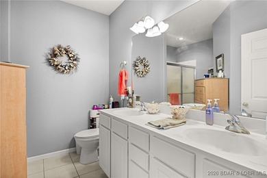 Enjoy peaceful lake living in this beautifully situated on The Club At Old Kinderhook in Missouri - for sale on GolfHomes.com, golf home, golf lot