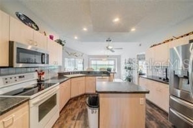 Charming St. Thomas Model with Pond & Conservation Views!  This on Caloosa Greens Executive Golf Course in Florida - for sale on GolfHomes.com, golf home, golf lot