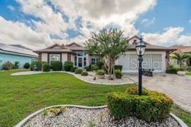 Charming St. Thomas Model with Pond & Conservation Views!  This on Caloosa Greens Executive Golf Course in Florida - for sale on GolfHomes.com, golf home, golf lot