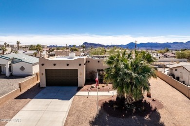 Welcome to this spacious Santa Fe Style 3-bedroom home in Lake on London Bridge Golf Course in Arizona - for sale on GolfHomes.com, golf home, golf lot