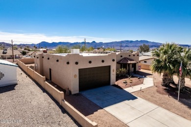 Welcome to this spacious Santa Fe Style 3-bedroom home in Lake on London Bridge Golf Course in Arizona - for sale on GolfHomes.com, golf home, golf lot