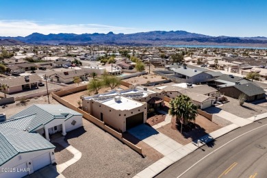 Welcome to this spacious Santa Fe Style 3-bedroom home in Lake on London Bridge Golf Course in Arizona - for sale on GolfHomes.com, golf home, golf lot