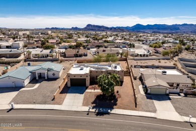 Welcome to this spacious Santa Fe Style 3-bedroom home in Lake on London Bridge Golf Course in Arizona - for sale on GolfHomes.com, golf home, golf lot