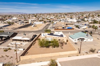 Welcome to this spacious Santa Fe Style 3-bedroom home in Lake on London Bridge Golf Course in Arizona - for sale on GolfHomes.com, golf home, golf lot