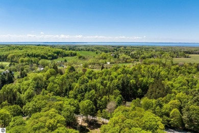 Nicely mature, wooded 1.07 acre lot in a quiet subdivision on A-Ga-Ming Golf Resort in Michigan - for sale on GolfHomes.com, golf home, golf lot