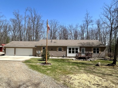 Privacy and seclusion await at this true Up North retreat! This on Forest Dunes Golf Club in Michigan - for sale on GolfHomes.com, golf home, golf lot