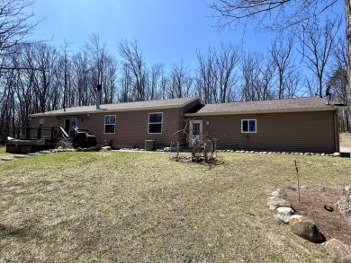 Privacy and seclusion await at this true Up North retreat! This on Forest Dunes Golf Club in Michigan - for sale on GolfHomes.com, golf home, golf lot