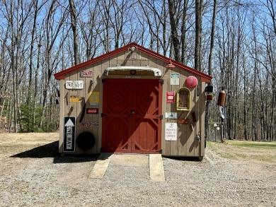 Privacy and seclusion await at this true Up North retreat! This on Forest Dunes Golf Club in Michigan - for sale on GolfHomes.com, golf home, golf lot