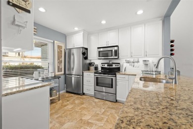 EXCEPTIONAL VALUE for this SPECTACULAR GOLF COURSE TOWNHOME IN on Isla Del Sol Yacht and Country Club in Florida - for sale on GolfHomes.com, golf home, golf lot