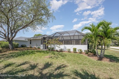 Gorgeous paver driveway and lush landscaping greet you as you on Indian River Colony Club in Florida - for sale on GolfHomes.com, golf home, golf lot