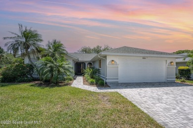 Gorgeous paver driveway and lush landscaping greet you as you on Indian River Colony Club in Florida - for sale on GolfHomes.com, golf home, golf lot