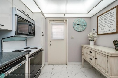 EXPERIENCE DRAMATIC WATER VIEWS FROM THIS CORNER TURNKEY UNIT! on Palm-Aire Country Club and Resort - Palms in Florida - for sale on GolfHomes.com, golf home, golf lot