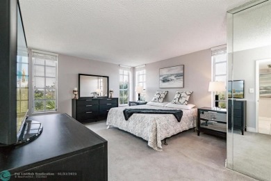 EXPERIENCE DRAMATIC WATER VIEWS FROM THIS CORNER TURNKEY UNIT! on Palm-Aire Country Club and Resort - Palms in Florida - for sale on GolfHomes.com, golf home, golf lot