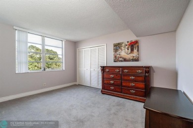 EXPERIENCE DRAMATIC WATER VIEWS FROM THIS CORNER TURNKEY UNIT! on Palm-Aire Country Club and Resort - Palms in Florida - for sale on GolfHomes.com, golf home, golf lot