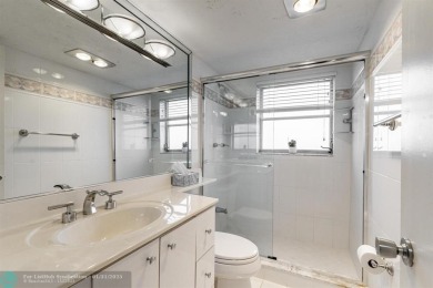 EXPERIENCE DRAMATIC WATER VIEWS FROM THIS CORNER TURNKEY UNIT! on Palm-Aire Country Club and Resort - Palms in Florida - for sale on GolfHomes.com, golf home, golf lot