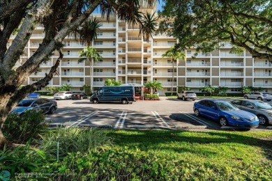 EXPERIENCE DRAMATIC WATER VIEWS FROM THIS CORNER TURNKEY UNIT! on Palm-Aire Country Club and Resort - Palms in Florida - for sale on GolfHomes.com, golf home, golf lot