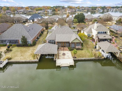 Experience waterfront living at its finest in Lake Caroline with on Lake Caroline Golf Club in Mississippi - for sale on GolfHomes.com, golf home, golf lot