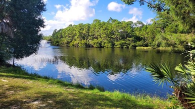 Versatile 4-br, 3-ba Abacoa residence with sparkling LAKE VIEWS on The Club At Admirals Cove Golf Village in Florida - for sale on GolfHomes.com, golf home, golf lot