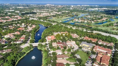 Versatile 4-bedroom, 3-bath Abacoa residence with sparkling LAKE on The Club At Admirals Cove Golf Village in Florida - for sale on GolfHomes.com, golf home, golf lot